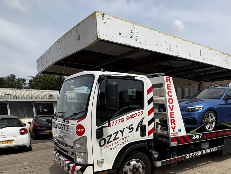 Blue car on the Ozzy’s Breakdown Recovery truck