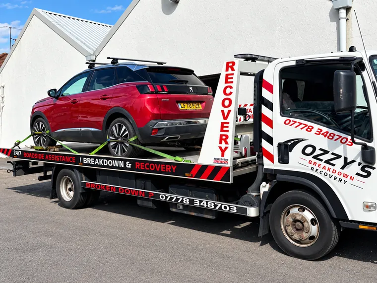 Red Peugeot on the Ozzy’s Breakdown Recovery truck